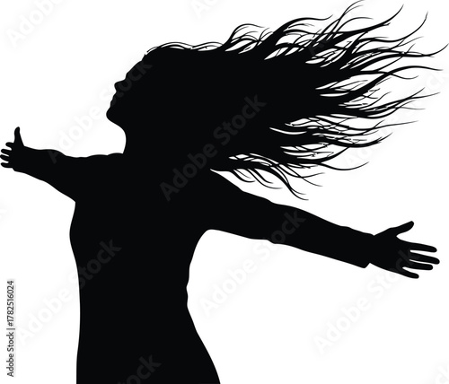 Woman silhouette with arms outstretched and hair blowing in the wind symbolizing freedom and empowerment