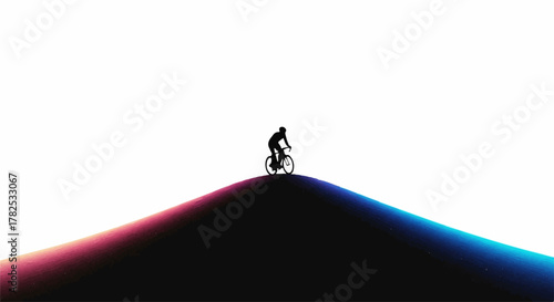Silhouette cyclist rides over a vibrant, colorful hill against a bright white sky.