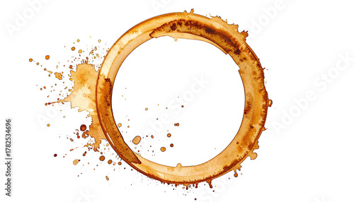 Brown coffee stain ring shape with splatters on black background