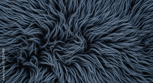 Close up of soft blue faux fur fabric with detailed texture and flowing strands