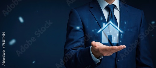 Professional holding digital house icon, symbolizing real estate investment and property.