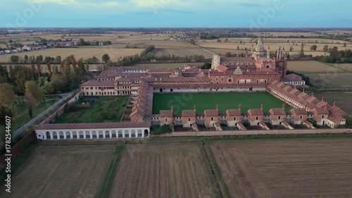 Certosa di Pavia aerial view at evening  Gra-Car (Gratiarum Carthusia, Monastery of Santa Maria delle Grazie - Sec. XIV),Pavia, Italy.