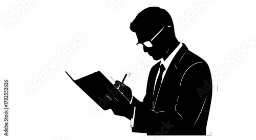 Focused businessman in silhouette diligently writing in a notebook with a pen