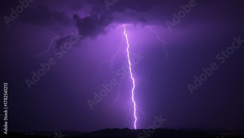 Dramatic purple lightning illuminating a stormy night sky, capturing raw natural energy.