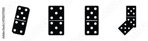 Four dominoes displaying various dot patterns and orientations for game play