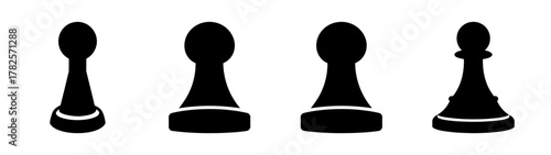 Four black chess pawns lined up ready for strategic gameplay on a