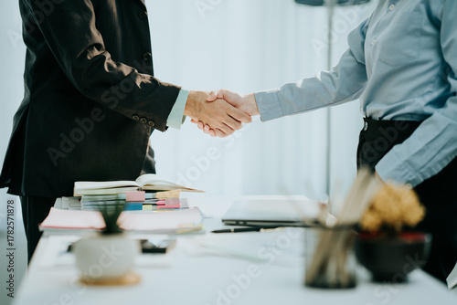 Deal Agreed: Two business partners seal a partnership with a firm handshake, symbolizing trust, collaboration, and a shared vision of success.