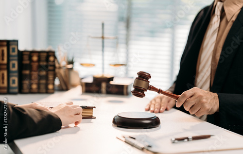 Judicial Proceedings: An interior shot depicts a legal setting with a gavel poised for action, as a judge or lawyer prepares to preside over a case.