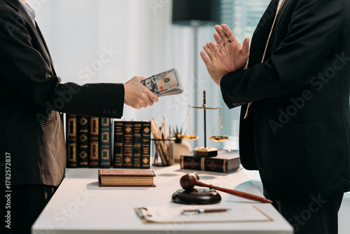 Bild auf Leinwand Legal Bribery: An unsettling scene unfolds within a legal environment, where a bribe is offered, raising questions of integrity and corruption within the legal system