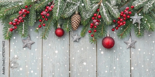 Winter Holiday Decoration Festive Evergreen Branches Red Berries Ornaments and Snowflakes Copy Space Background.	