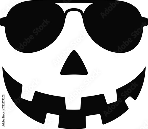 Black silhouette of a happy halloween pumpkin face with sunglasses