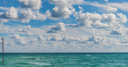 Fototapeta Naklejka Na Ścianę i Meble -  Horizon with sea cloudy sky. Calm horizon at sea. Romantic summer vacation seascape. Seascape horizon paradise. Sea sunrise on ocean beach. Sunset seascape at summer vacation. Walk along beach