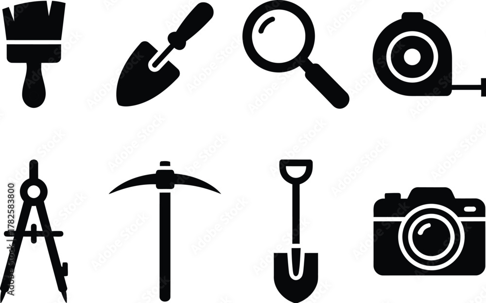 Obraz premium Tool Icon Set – Black Silhouettes of Paintbrush, Trowel, Compass, Pickaxe, Shovel, Camera, and More for Creative, Construction, and Exploration Design Projects