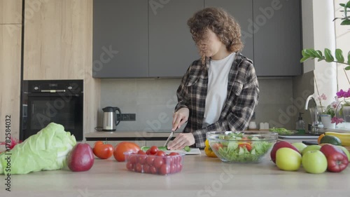 Preparing Fresh Cucumber Slices In Bright Home Kitchen For Healthy Meal