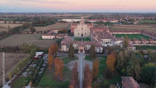Certosa di Pavia aerial view at sunset Gra-Car (Gratiarum Carthusia, Monastery of Santa Maria delle Grazie - Sec. XIV),Pavia, Italy.