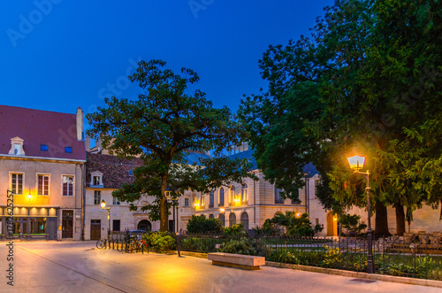 Fototapeta Naklejka Na Ścianę i Meble -  Place des Ducs de Bourgogne square in Dijon city historical centre with old typical houses medieval buildings, small park and green square, Dijon old town on twilight dusk evening view, France