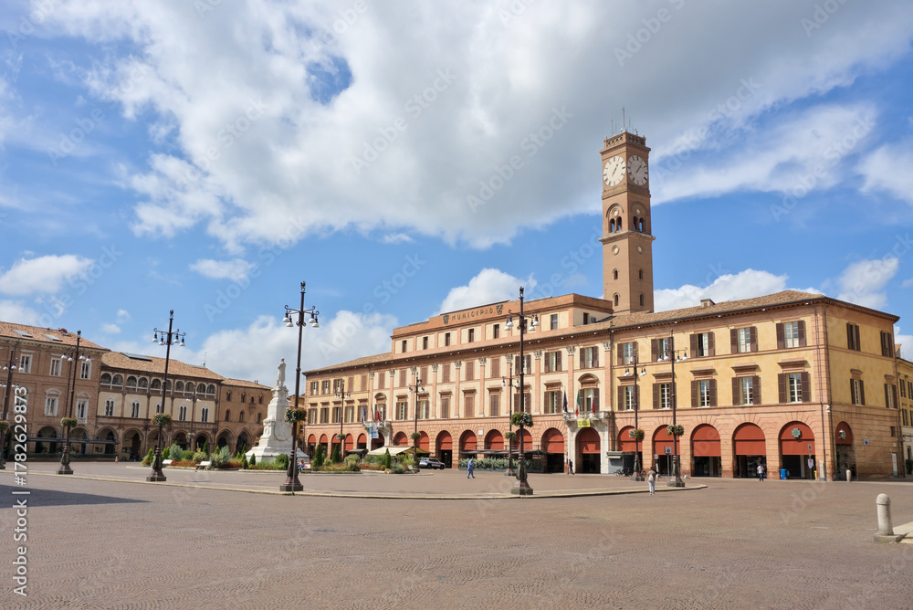 Fototapeta premium Monumental Piazza Saffi in Forlì, Italy, featuring a clock tower and porticoed Renaissance architecture.