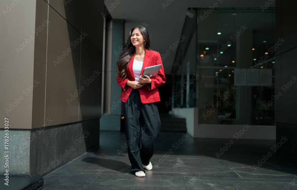 custom made wallpaper toronto digitalAsian business woman walking and smiling with tablet