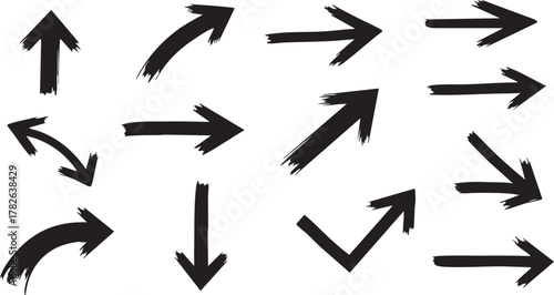 Assortment of sharp black arrows rendered with a thick brush stroke texture pointing in various cardinal and diagonal directions