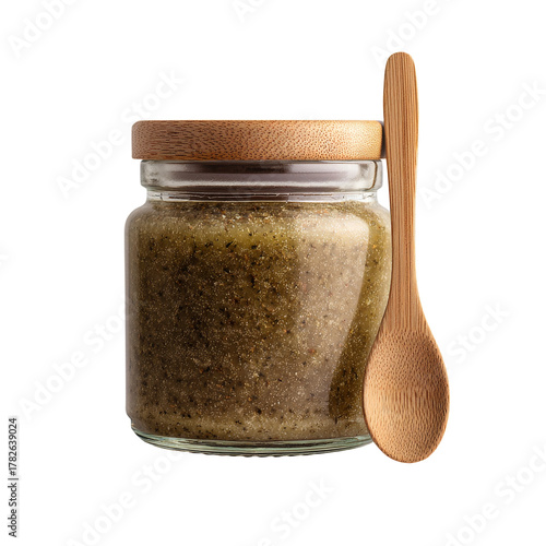 Natural Green Sugar Scrub in a Glass Jar With a Wooden Spoon Beside It