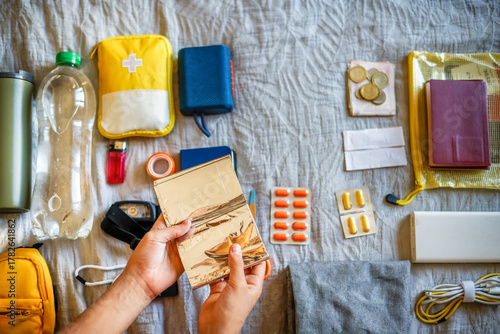 Emergency set assembly - close-up of thermal blanket in woman's hands