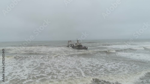 2 Namibia shipwreck, Drone Shot tracking in and tilting down of fishing vessel near Swakopmund
