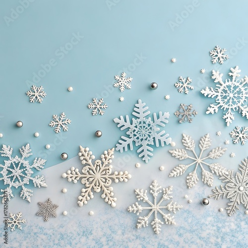 Elegant White and Silver Snowflakes on Pastel Blue Background