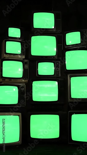 Wallpaper Mural Stack of Possibilities with pile retro tvs green screen turning on and off distortion, overlay, glitch, static noise, scan lines black background, 4k animated video loop Torontodigital.ca