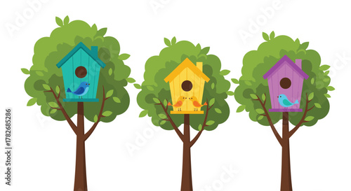 Three colorful birdhouses hanging from trees with small birds.