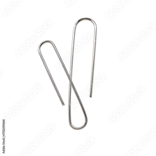 Fényképezés Silver metal paper clip isolated on white, an essential office stationery object