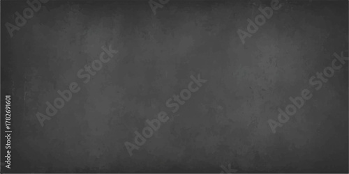 Dark vintage grunge texture background of an empty black chalkboard or blackboard with chalk dust