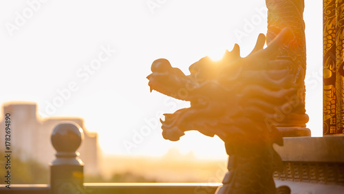 Dragon sculpture at Taiwanese temple in Taichung during golden sunset