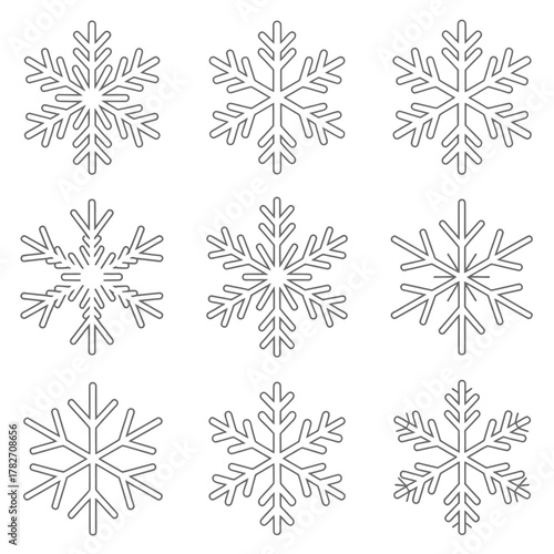 Collection of nine intricate hand drawn snowflake illustrations in a grid pattern perfect for winter holiday and christmas design elements
