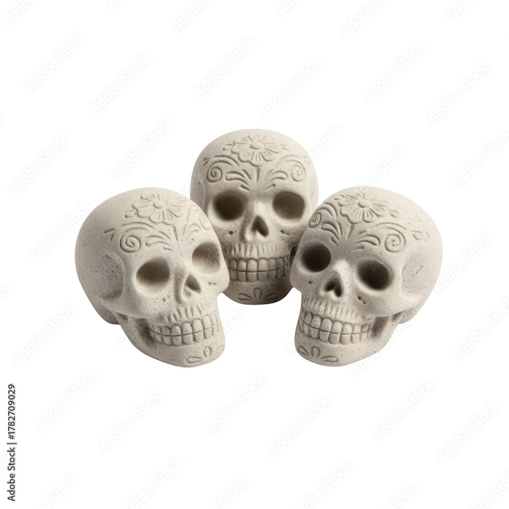 Obraz premium Three decorative skulls adorned with floral motifs, symbolizing remembrance and tradition