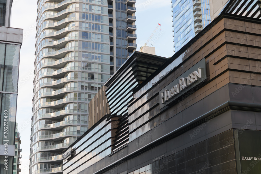 Naklejka premium exterior building facade and sign of Harry Rosen, a men's clothing store, located at 82 Bloor St W, Toronto