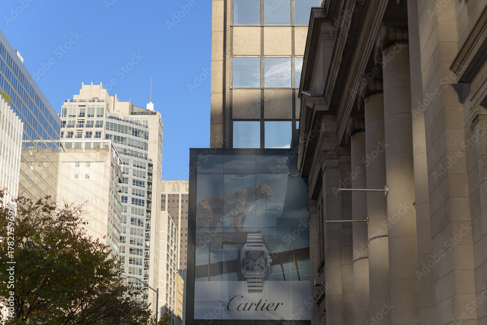 Obraz premium view east on Bloor St W near Queens Park/Avenue Rd with banner ad for Cartier watches, Toronto