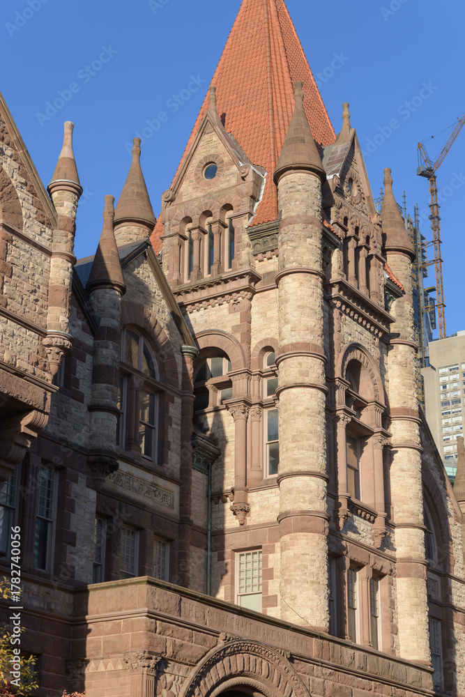 Naklejka premium exterior of Victoria College, designed by William G Storm, in Richardsonian Romanesque, completed 1892, located at 73 Queen's Park Cres E, University of Toronto