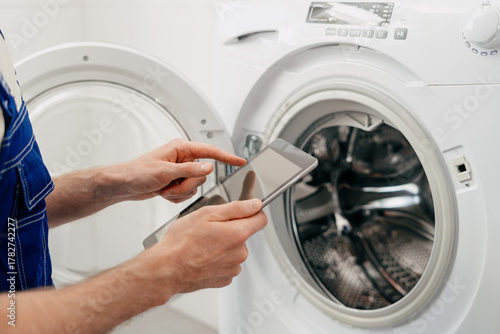 Repairing a washing machine at home for routine maintenance and service needs