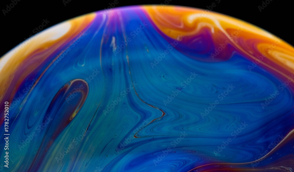 Fototapeta premium closeup photo of colored light reflection on the surface of soap bubble