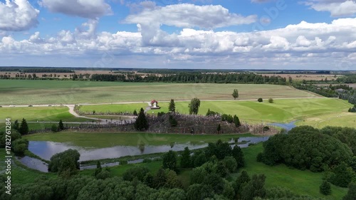 Hill of Crosses, Siauliai, Lithuania — August 1, 2025: Panoramic aerial footage captured by drone. The scene shows thousands of wooden and metal crosses, walking paths and the surrounding countryside 