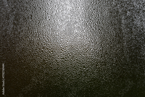 Close view of dark glass fogged up in damp weather