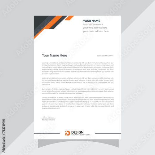 Modern professional business letterhead design with abstract orange and grey geometric accents and company logo at the bottom for corporate branding and official correspondence