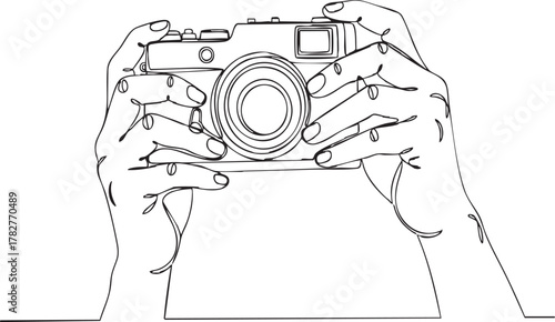 Continuous line drawing of a camera held in hands for minimalist design and photography concepts, ideal for creative projects