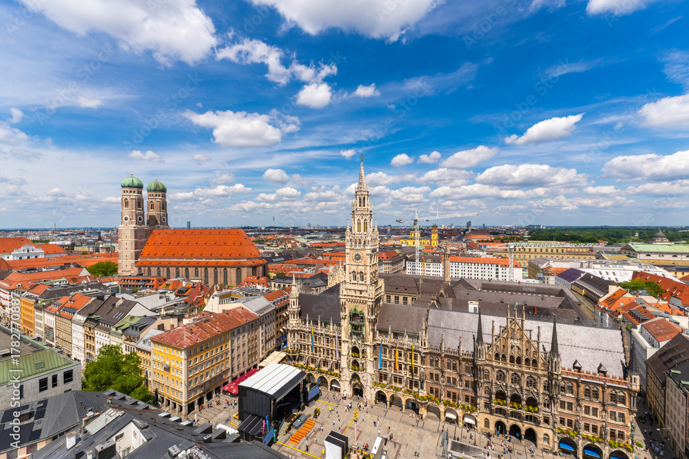 Fototapeta premium New Town Hall and Frauenkirche Church on Sunny Summer Day. Tourists on Marienplatz. Munich Skyline Panorama. Old Town. Bavaria, Germany. View from Tower of Alter Peter. Wide Shot