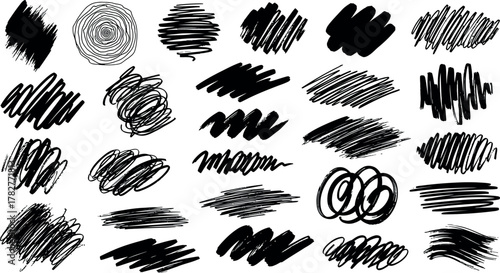 Collection of diverse hand drawn black ink scribbles and brush strokes on white background