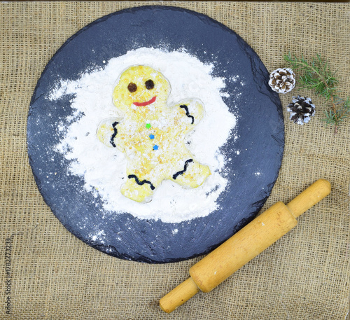Cooking a gingerbread man, Preparing for Christmas.