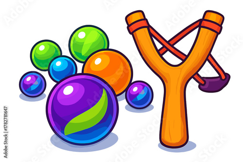Classic wooden slingshot with rubber band and a group of bright glossy game balls