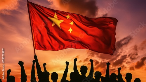 Chinese flag waving with silhouette of people with fists up.