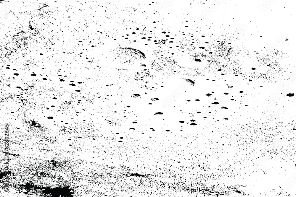 Fototapeta premium Abstract black and white textured background with scattered dots and circular shapes, resembling a distressed surface or cosmic dust.