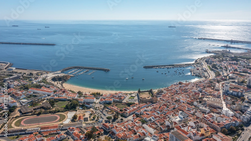 sines portugal. harbor dawn scene, early morning maritime activity with shining reflections at sunrise, aerial perspective capturing sunrise reflections and bustling